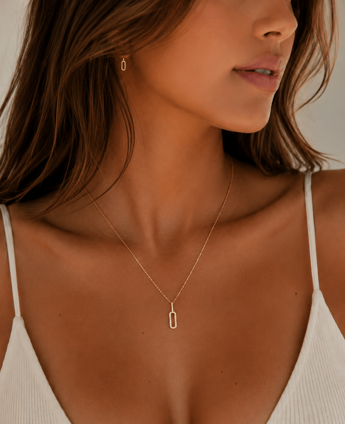 Woman wearing the Juliette Gold Crystal Pendant Necklace
