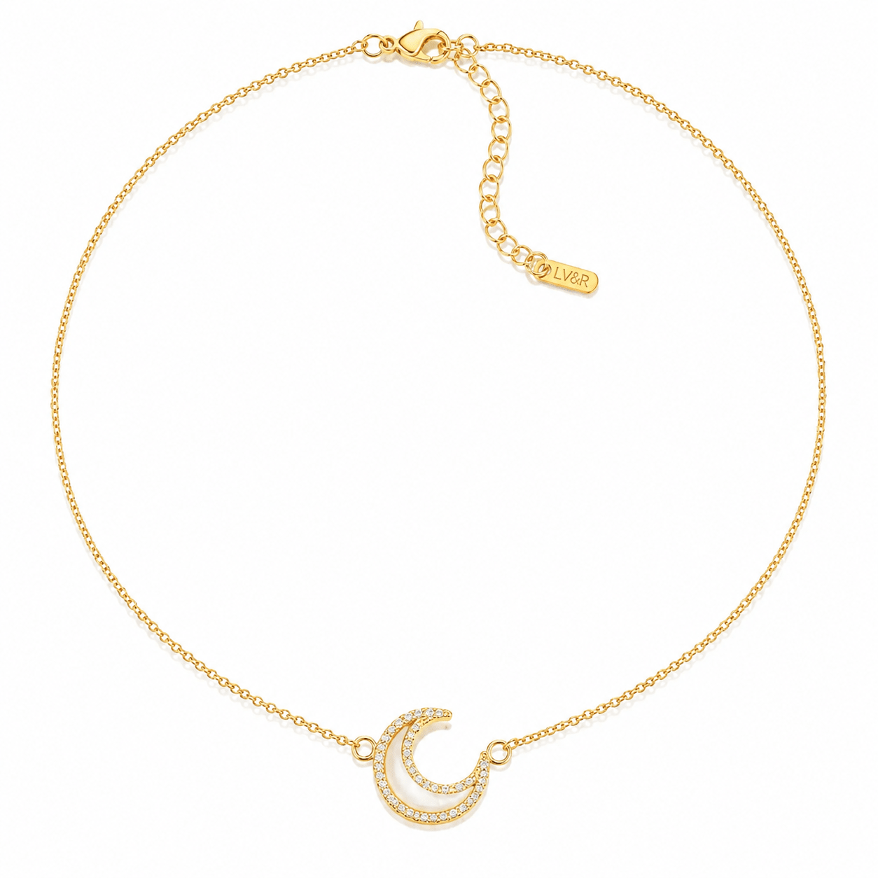 Nina Crystal Moon Necklace in gold, crescent moon pendant on a cable chain, product shot on a white background.