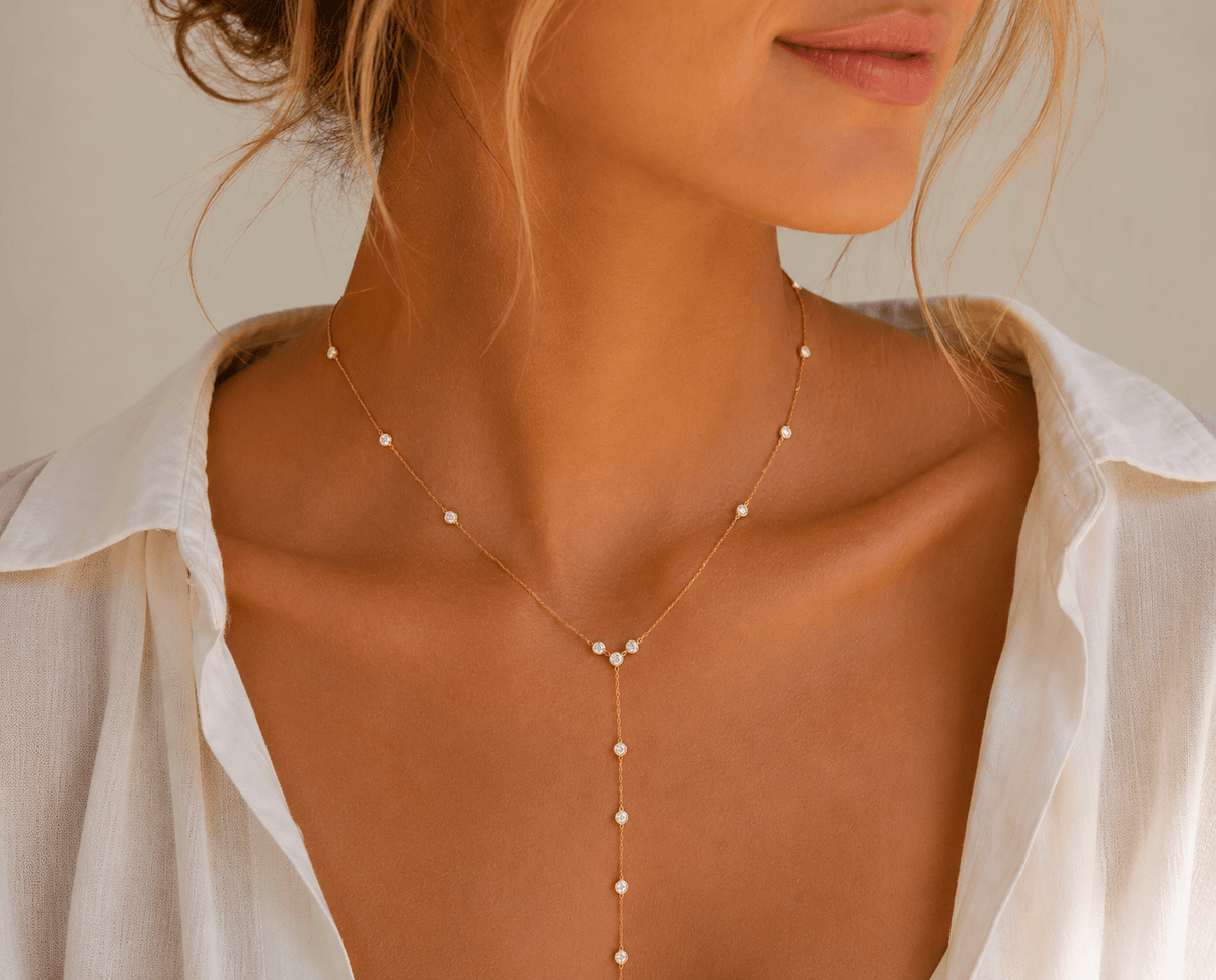 Woman wearing the Eva Gold Y-Chain Necklace
