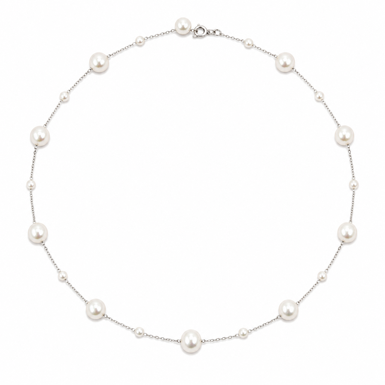 A delicate silver chain necklace featuring large, round white freshwater pearls spaced evenly along the chain, displayed on a clean white background.