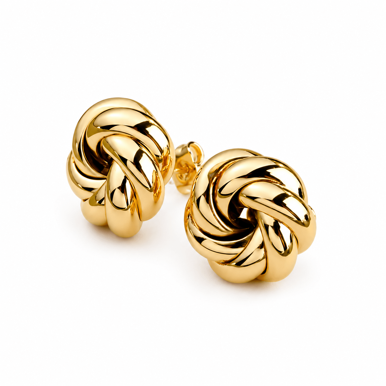 A pair of polished yellow gold knot stud earrings on a clean white background.