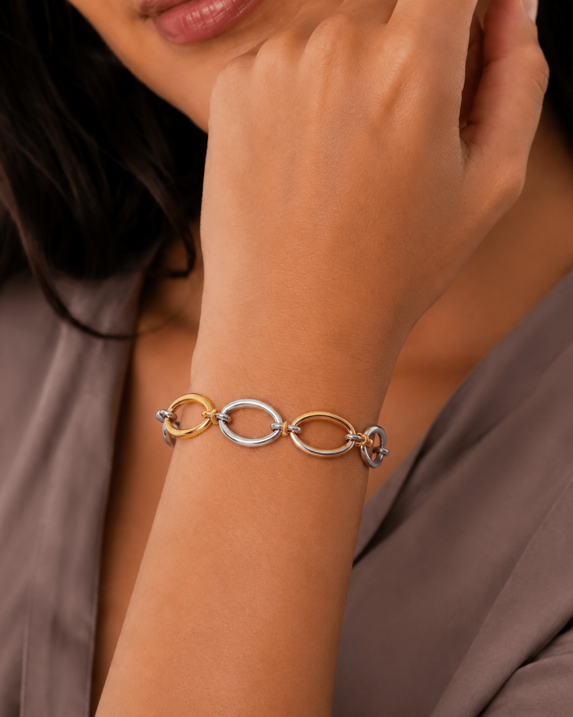 Woman wearing the Cora Two-Tone Oval Link Bracelet
