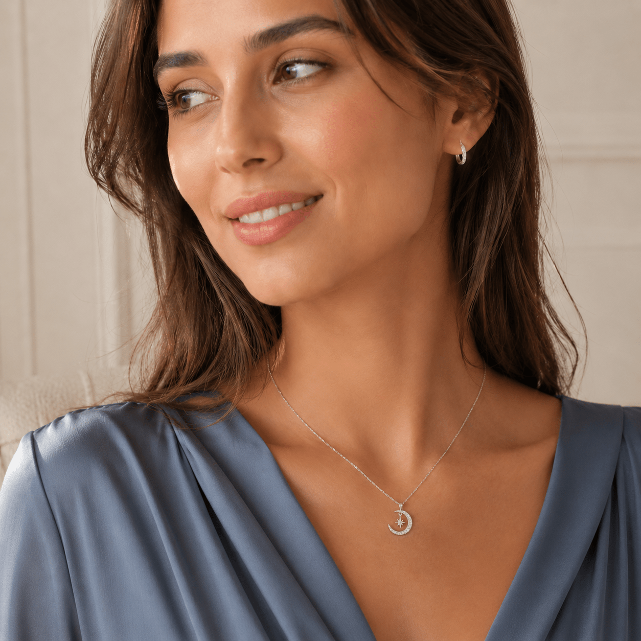 Close-up of Margot Silver Star and Crescent Moon Necklace showing the star and moon charms