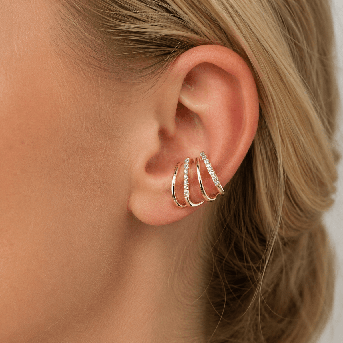 Close-up of Alba Gold Crystal Ear Climbers showing the crystal line