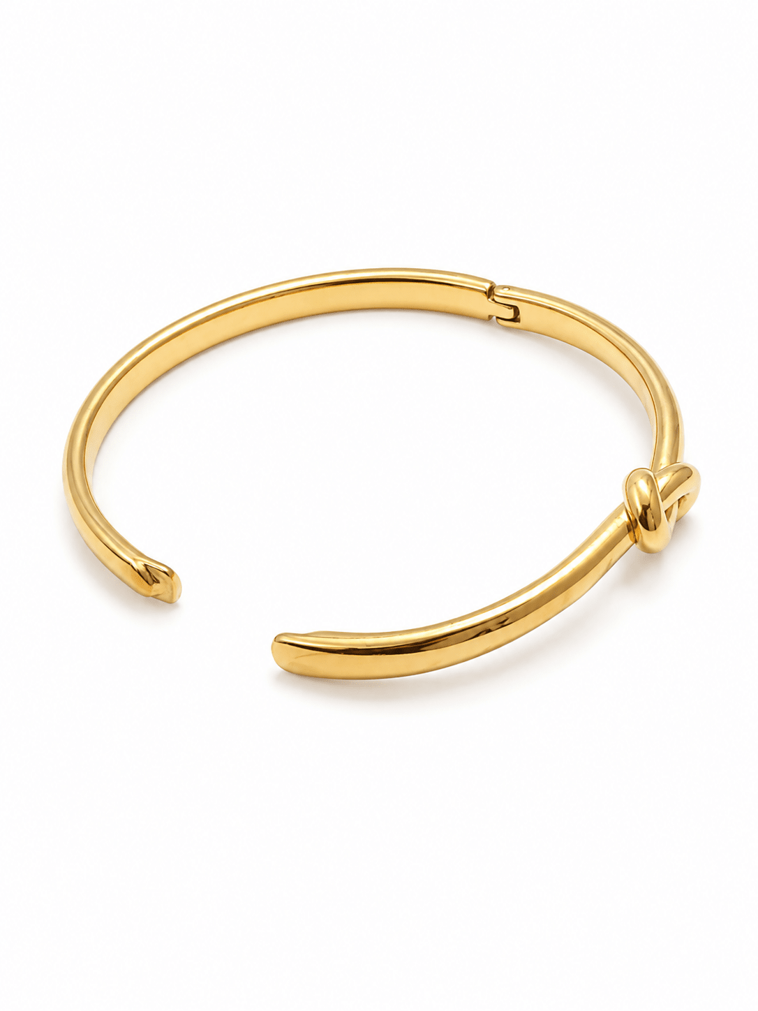 Lila gold twist bangle bracelet with sculptural knot, front view