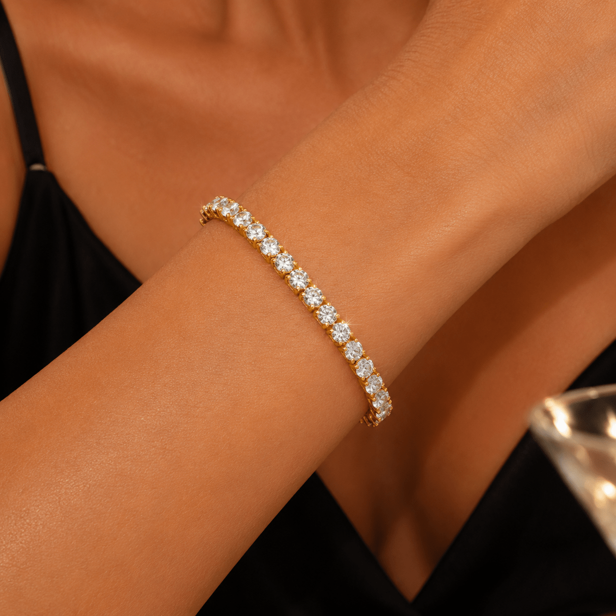 Woman wearing the Ashleigh gold tennis bracelet