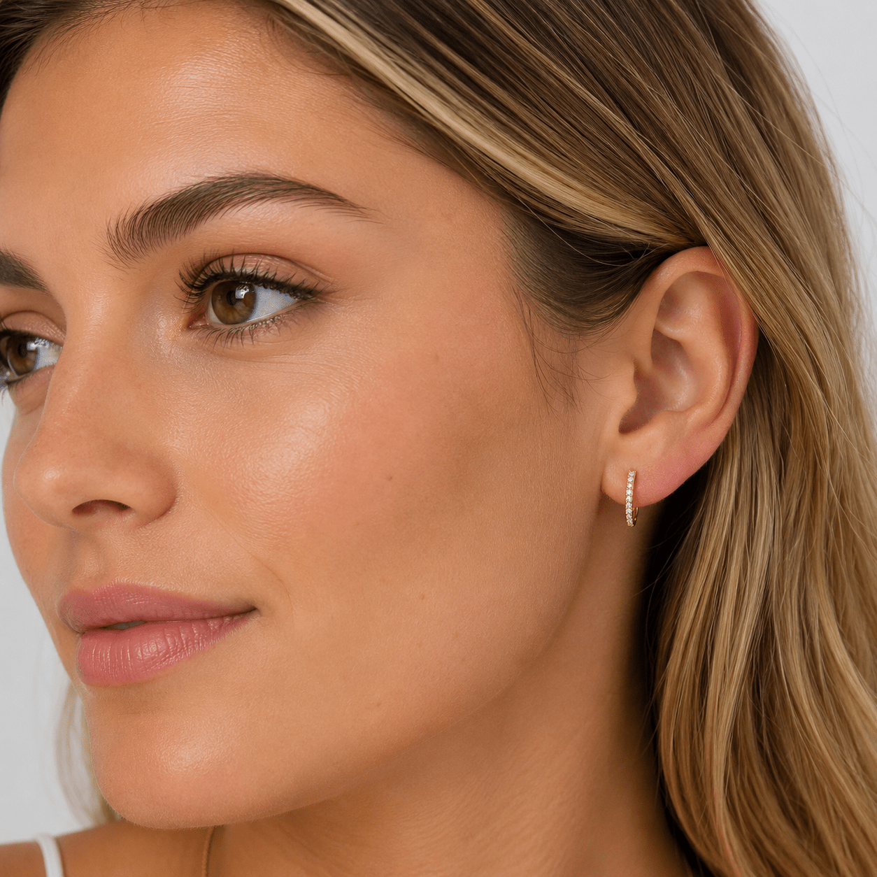 Ximena Gold U-Shape Crystal Earrings worn on model