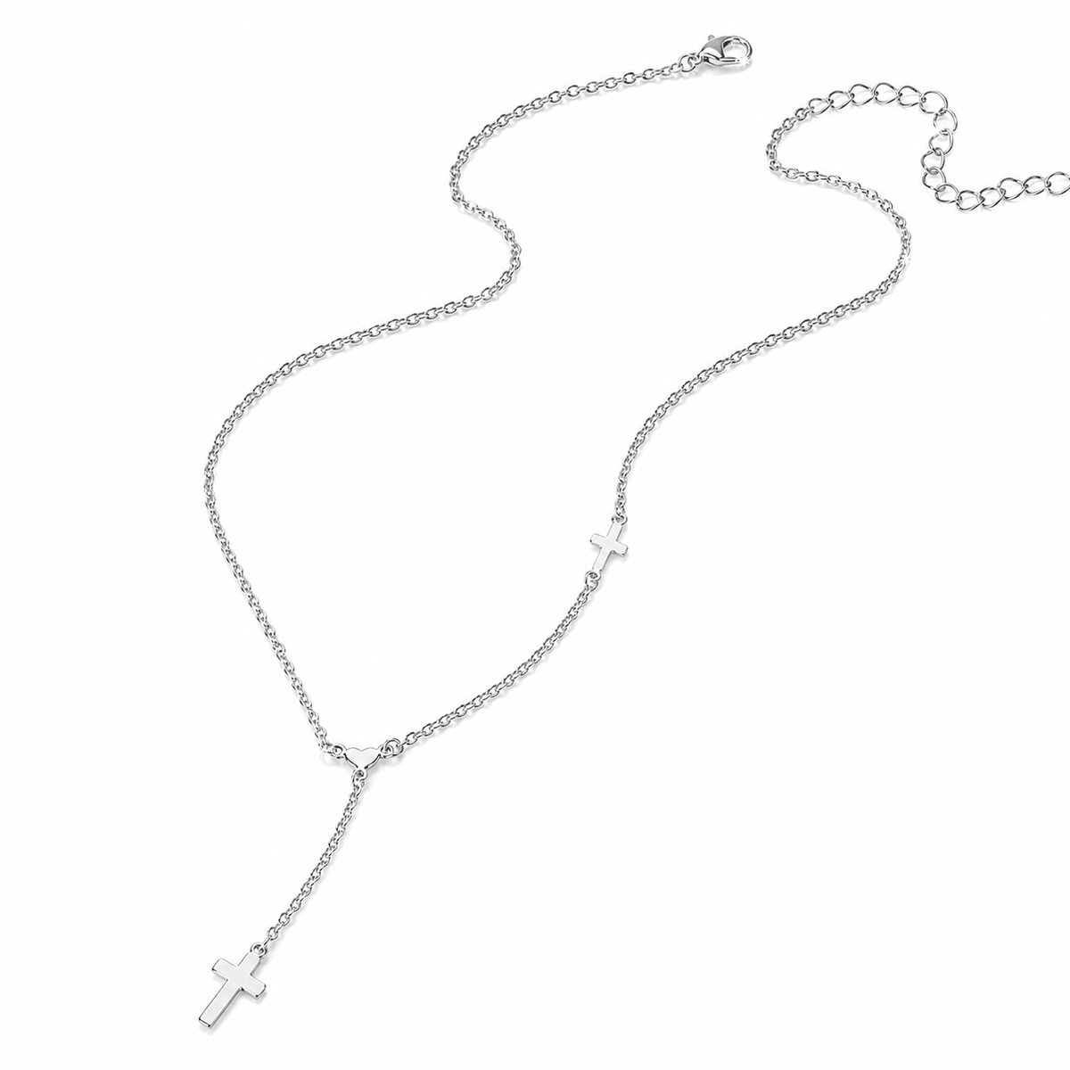 A silver Y-necklace featuring a delicate chain with two small cross charms, one larger and one smaller, displayed on a clean white background.
