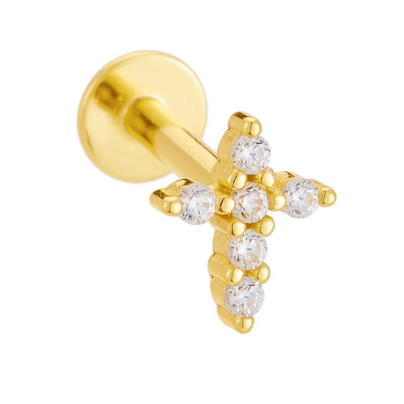 Gold cross-shaped earring with clear CZ stones on a white background