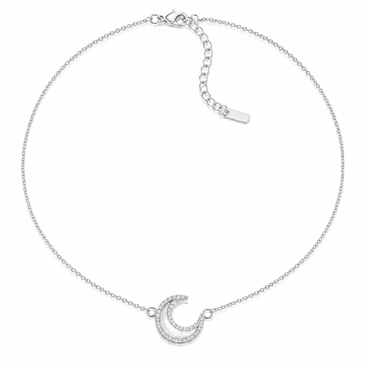 Nina Crystal Moon Necklace in silver, crescent moon pendant on a cable chain, product shot on a white background.