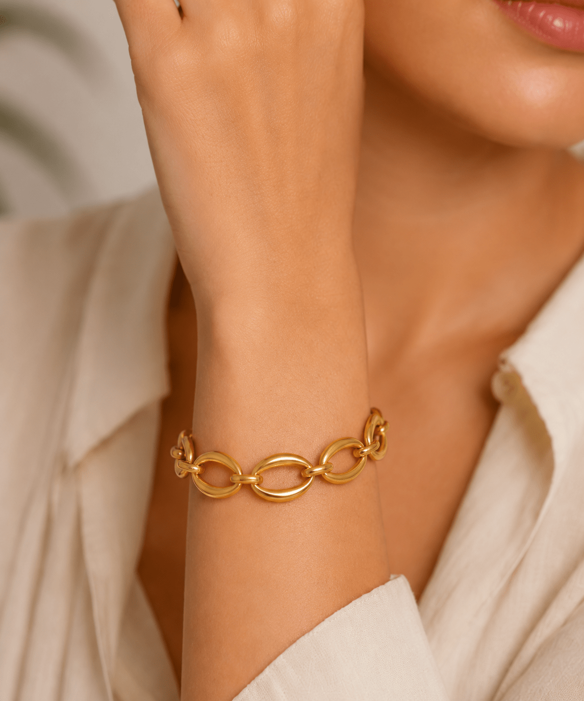 Woman wearing the Greta Gold Oval Link Chain Bracelet