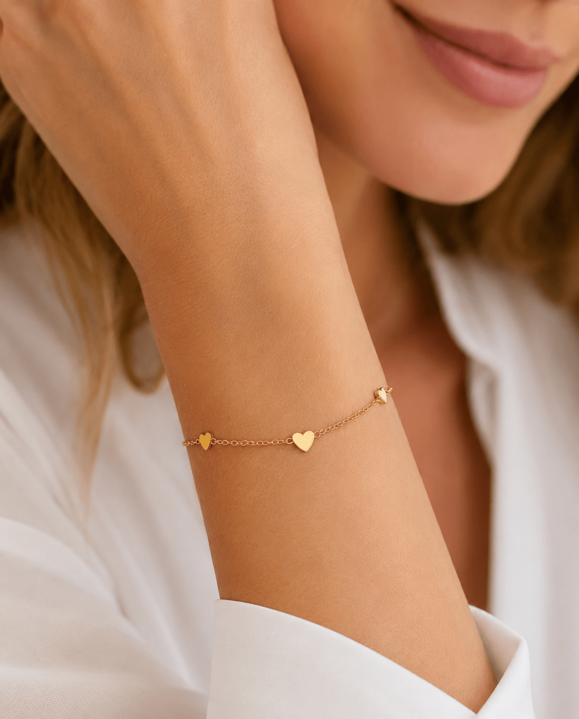 Side view of Hazel Gold Heart Charms Bracelet showing the clasp