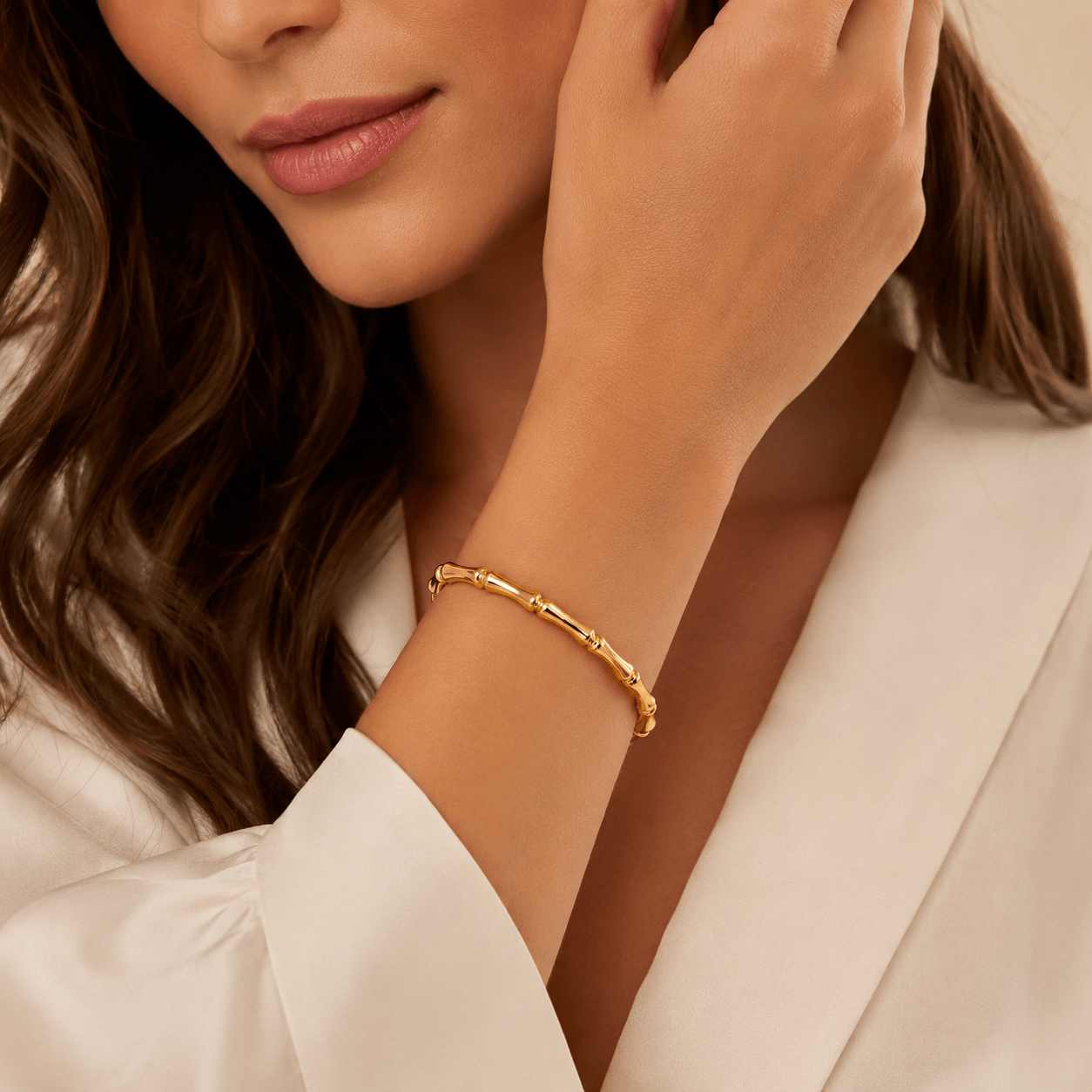 Close-up of Elena Gold Sculptural Bangle Bracelet showing the polished finish
