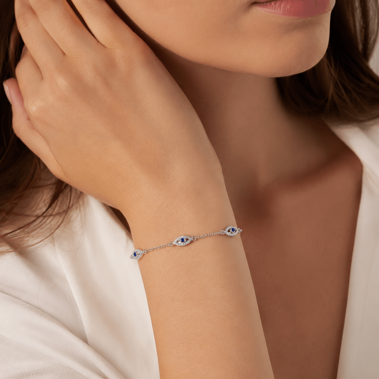 Close-up of Marlowe Silver Evil Eye Bracelet showing the evil eye charm