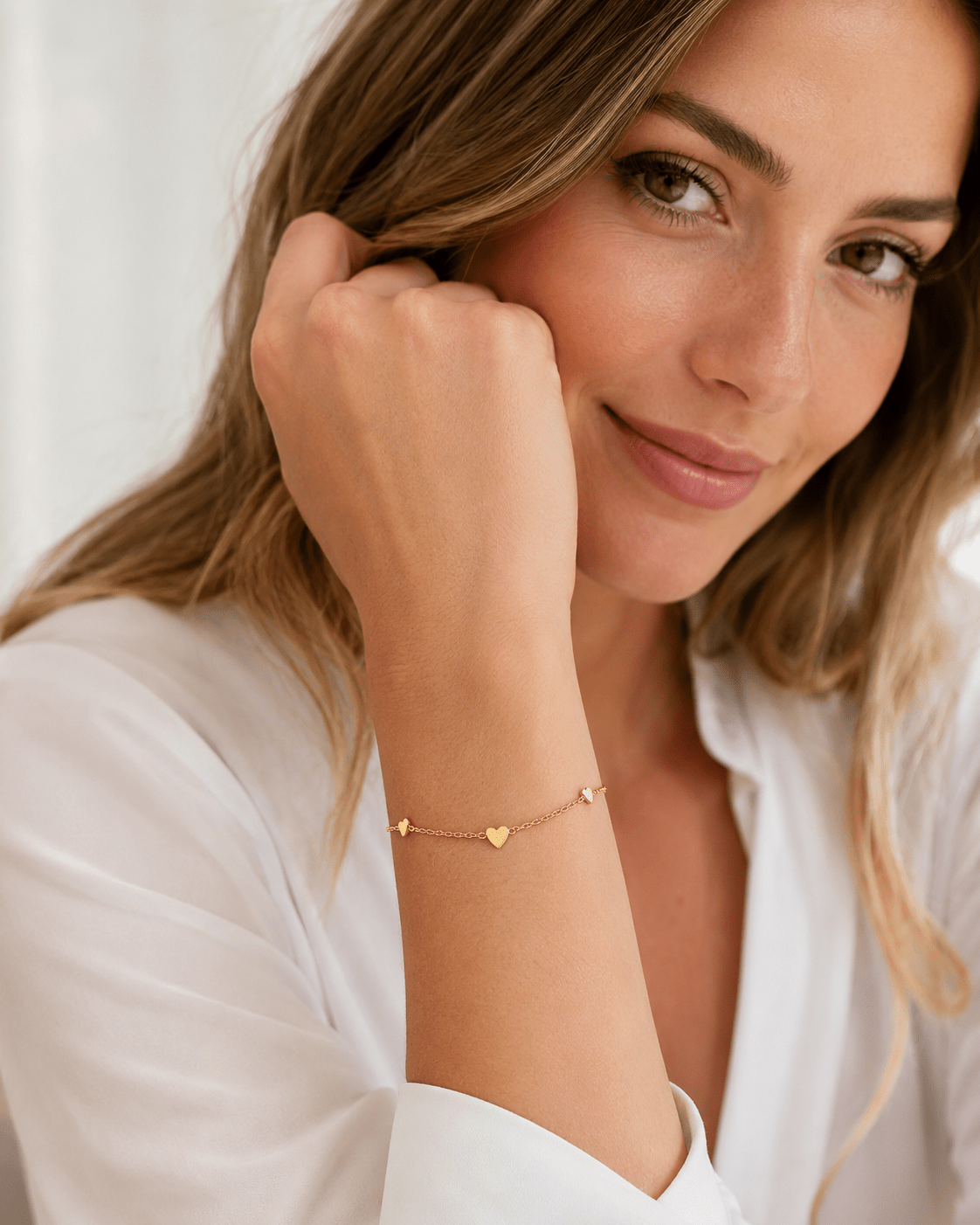 Close-up of Hazel Gold Heart Charms Bracelet showing the heart charms