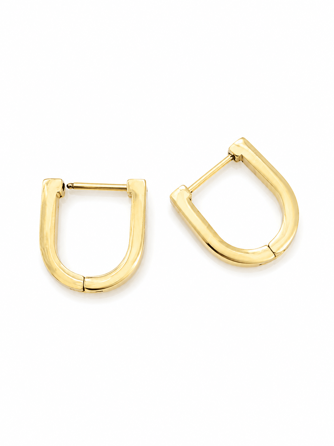 Close-up of Ada gold U-shape stud earrings with white CZ crystals