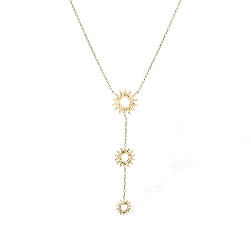A delicate gold Y-necklace featuring three small sunburst charms connected by short chains, displayed against a clean white background.