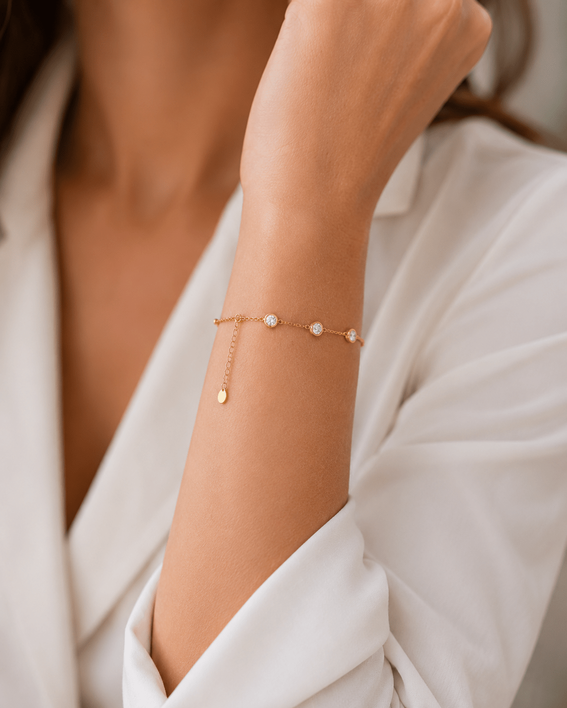 Woman wearing the Willa Gold Bar & Crystal Station Bracelet